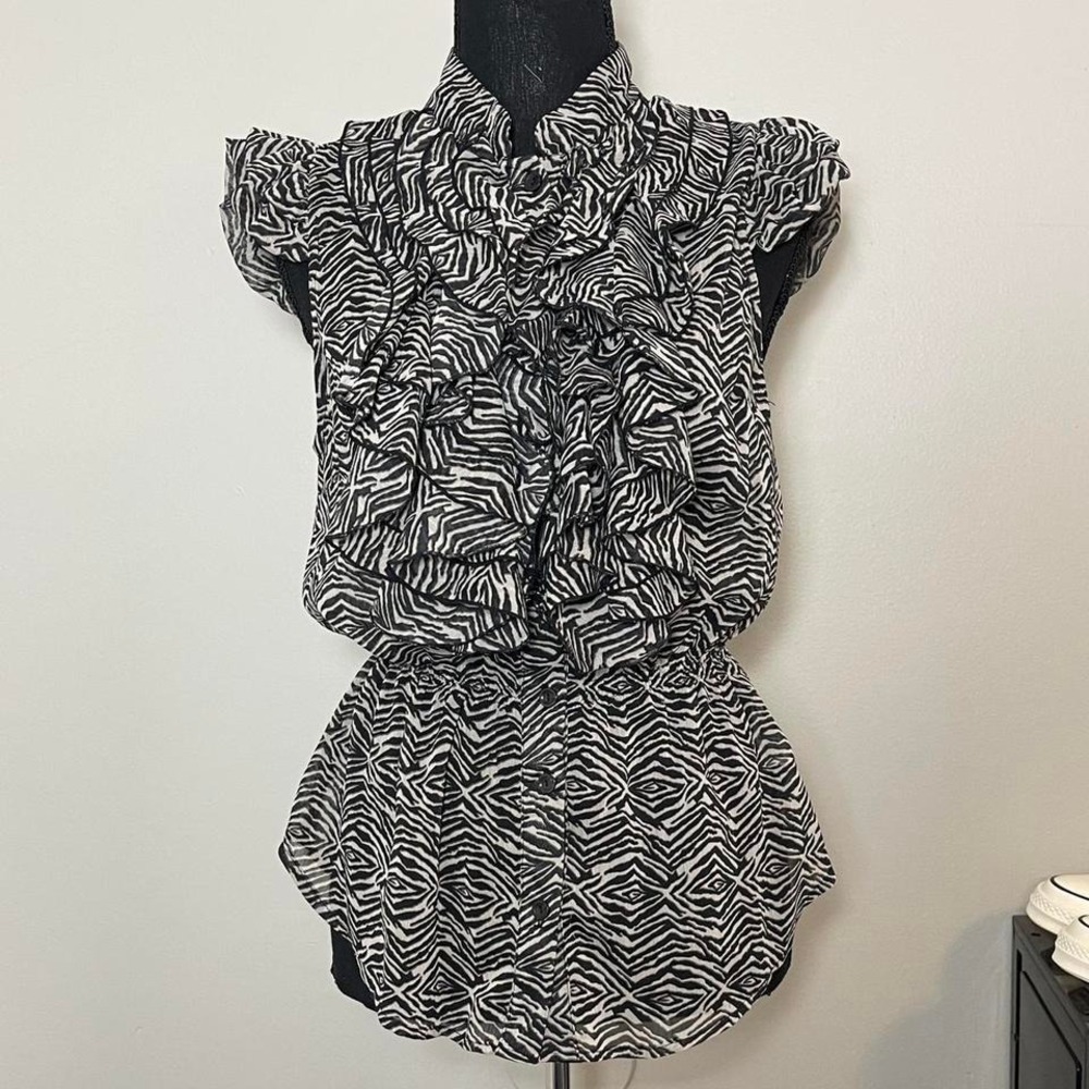Miley Cyrus black & white zebra print button up blouse with ruffle details